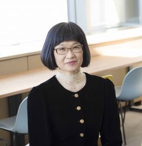 Akiko Aizawa sitting in a chair